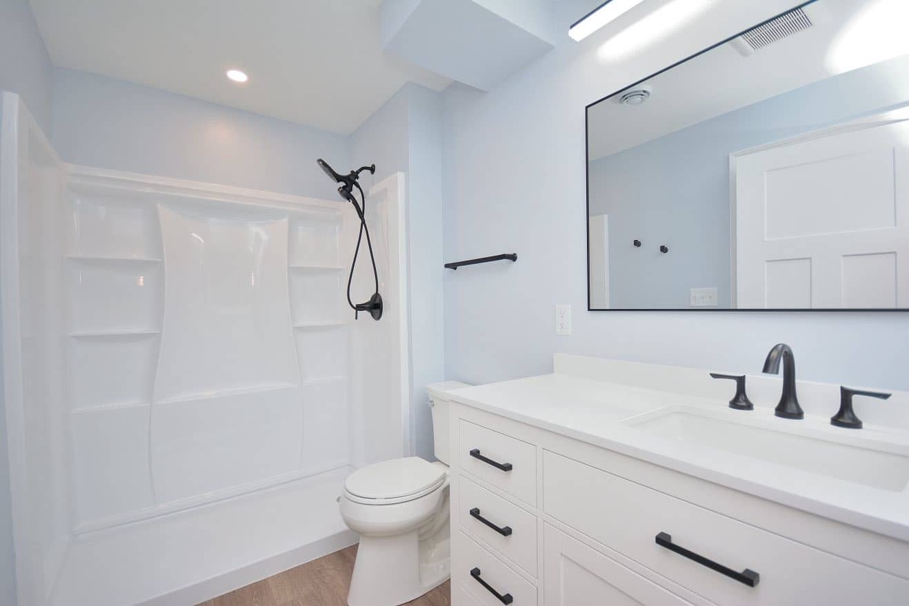 bathroom remodel in basement with new shower and toilet